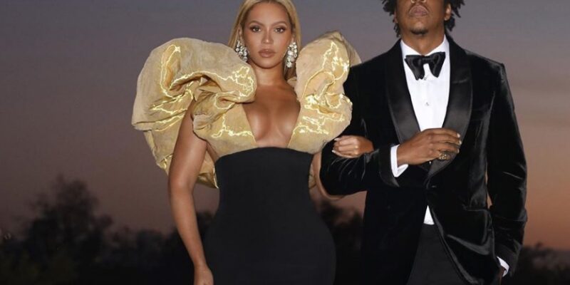 Rapper Jay-Z and Beyonce sit during National Anthem